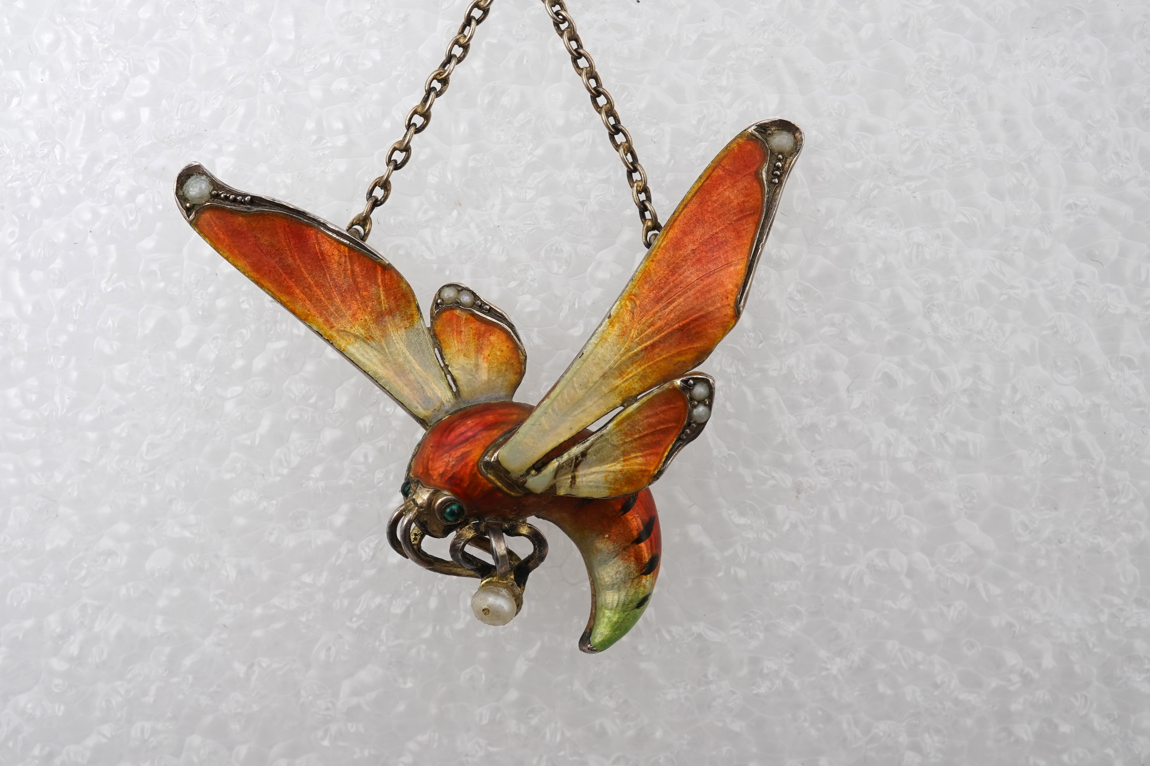 An unusual Art Nouveau silver gilt and enamel pendant, circa 1900